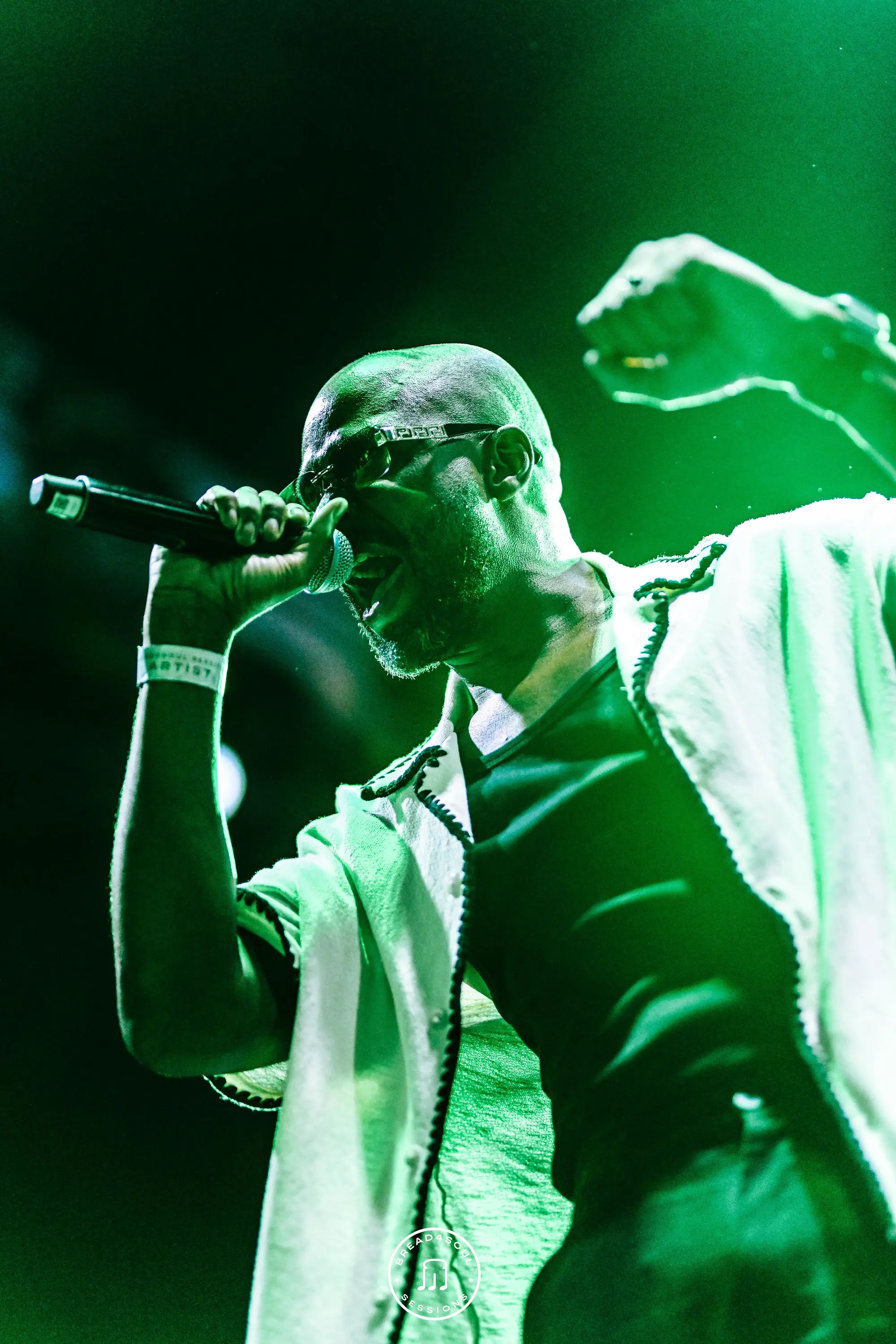 Emerald — singing bathed in green light