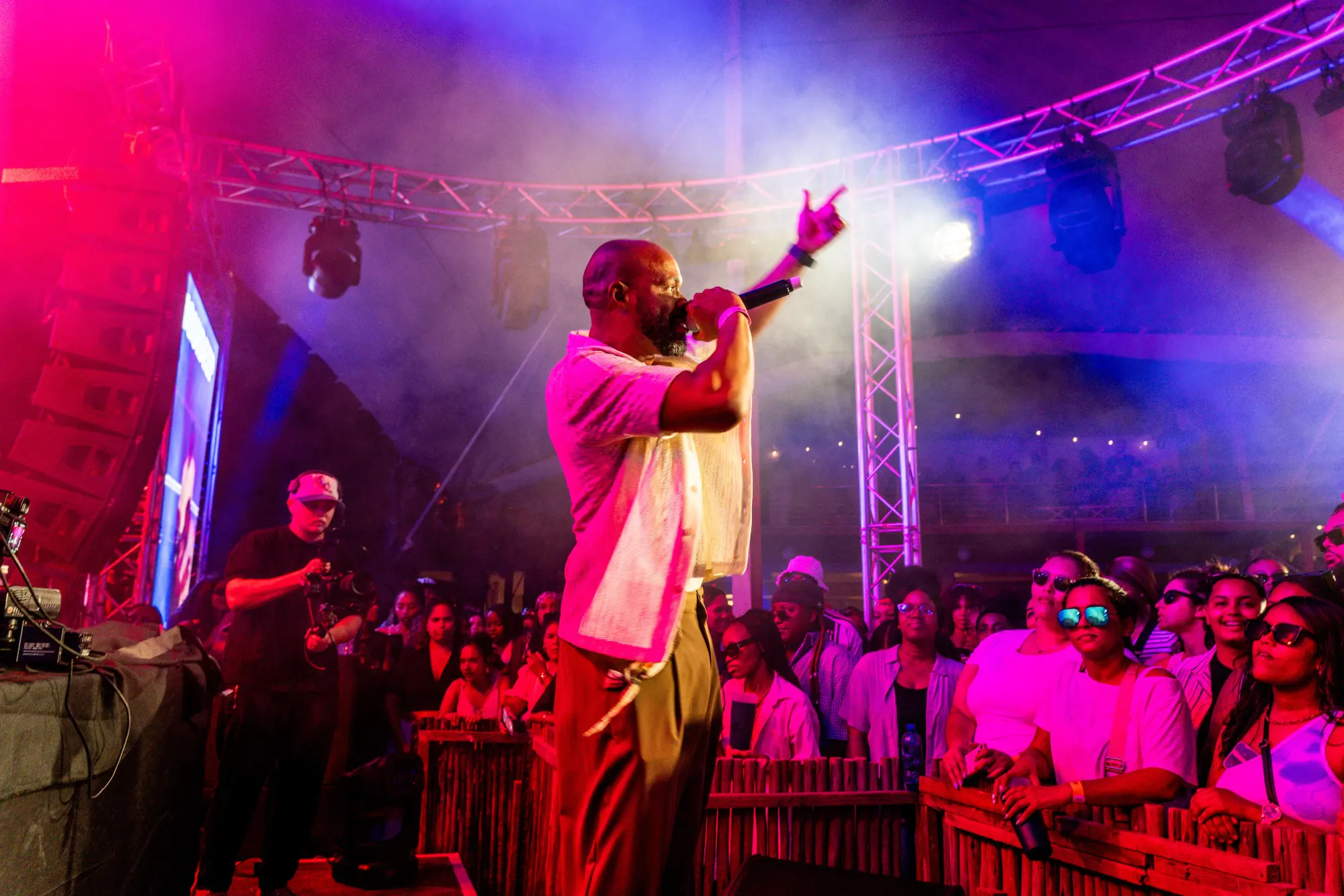 Rise — commanding the stage in purple and blue light